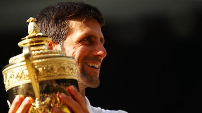 Novak Djokovic won his fourth Wimbledon title on Sunday. Clive Brunskill / Getty Images
