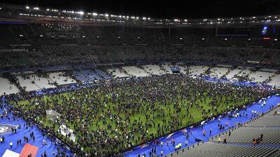 In this file photo spectators gather on the pitch of the Stade de France stadium after a series of gun attacks occurred across Paris in November 2015. AFP