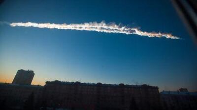 A meteor streaks across the sky of Russia's Ural Mountains on Friday morning, its shockwaves injuring about 1,000 people, including many hurt by broken glass.