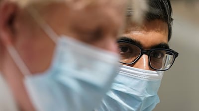 Prime Minister Boris Johnson and Chancellor Rishi Sunak during a visit to the Kent Oncology Centre at Maidstone Hospital on Monday. AFP