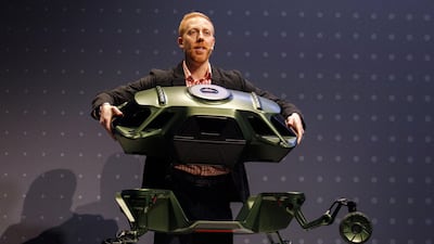 David Byron, industrial design manager of Sundberg-Ferar, holds a section of the Hyundai Elevate walking car concept. Bloomberg