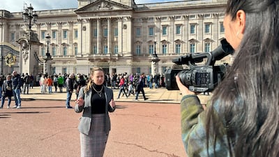 Reporter Laura O'Callaghan and multimedia journalist Amy McConaghy outside Buckingham Palace in London. The National