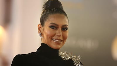 Egyptian actress Lekaa Elkhamissi poses on the red carpet at the closing ceremony of the 40th edition of the Cairo International Film Festival