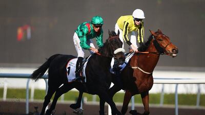Christophe Soumillon (L) riding Vazirabad on the way to victory against Jamie Spencer on Big Orange in the Dubai Gold Cup Sponsored By Al Tayer Motors as part of the Dubai World Cup at Meydan Racecourse on March 26, 2016 in Dubai, United Arab Emirates. (Photo by Francois Nel/Getty Images)