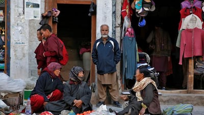 Vegetable vendors chat in Leh.
