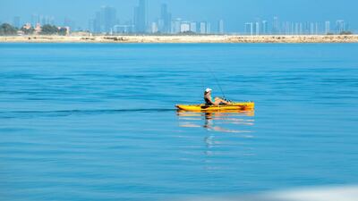 Recreational watercraft is a common sight on weekends along the Al Raha Creek, Aldar Headquarters area. Victor Besa / The National