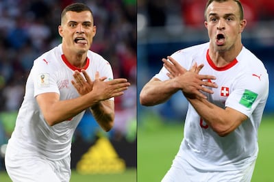 A combo of two pictures shows the celebration for the first goal of Switzerland's midfielder Granit Xhaka, (L), and the victory goal of Switzerland's midfielder Xherdan Shaqiri, (R), both making the eagle emblem of the Kosovo during the FIFA World Cup 2018 group E preliminary round soccer match between Switzerland and Serbia at the Arena Baltika Stadium, in Kaliningrad, Russia. Laurent Gillieron/ EPA