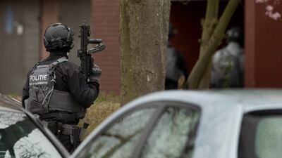 Dutch counter-terrorism police prepare to enter a house after a shooting incident in Utrecht. AP