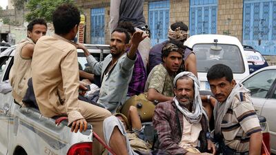 Displaced Yemenis who fled homes in war-torn port city of Hodeidah ride a pickup vehicle as clashes intensify in western coast areas