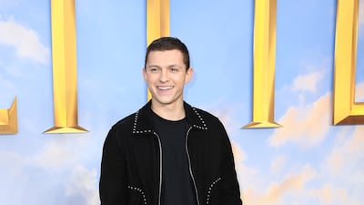 Tom Holland, in head-to-toe black Saint Laurent, attends the 'Dolittle' special screening with a pet dog in London on January 25, 2020. Getty Images