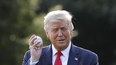 U. President Donald Trump plays catch on the South Lawn of the White House in Washington to celebrate opening day of the MLB season. Bloomberg