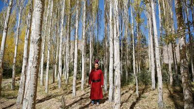 Tsering Gurmet, 28, a mountain guide, poses for a photograph in the village of Stok, 15 km from Leh.