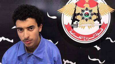 A handout photo made available by Libyan Special Deterrence Forces of the Interior Ministry shows Hashem Abedi, the younger brother of Manchester Arena bomber Salman Abedi, after he was arrested in Tripoli; the 22-year-old has appeared in London court.