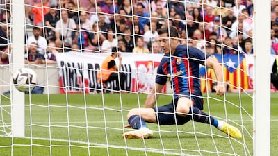 Robert Lewandowski scores Barca's first goal. Reuters