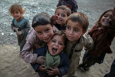 Afghan children play in a street in Kabul. EPA