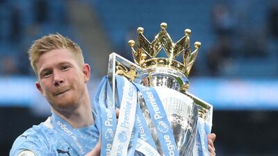 Manchester City's Kevin De Bruyne celebrates with the Premier League trophy after trouncing Everton on the final day of the 2020/21 season. Reuters