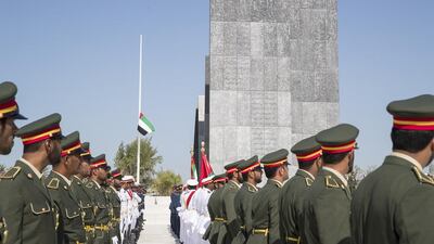 Members of the UAE Armed Forces participate in the Commemoration Day flag raising ceremony at Wahat Al Karama. Mohamed Al Hammadi / Crown Prince Court - Abu Dhabi