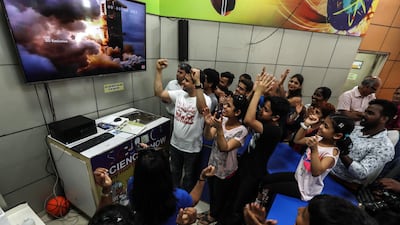 Indians cheer on the rocket blasting of the Moon. EPA