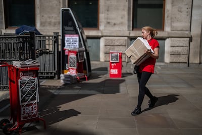 A vendor prepares to distribute copies of the Evening Standard newspaper on May 29, in London, England. The newspaper's dropping its daily print edition to become a weekly. Getty