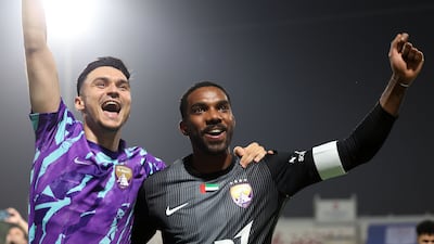 Khalid Essa, right, of Al Ain celebrates winning the league title