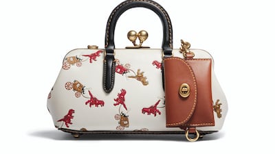 Dinosaurs pull along chariot-style carriages in a modern-meets-retro pattern