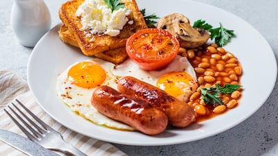 Full English breakfasts traditionally include eggs, sausages, bacon, baked beans, tomatoes, mushrooms, toast and a hot tea. Getty Images