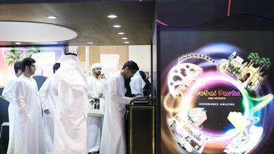 Visitors at Dubai Parks stand at the National Career Exhibition at Sharjah Expo Centre. Reem Mohammed / The National