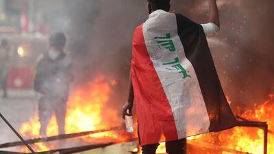 Anti-government protesters set fire and close streets during ongoing protests in Baghdad, Iraq. AP Photo