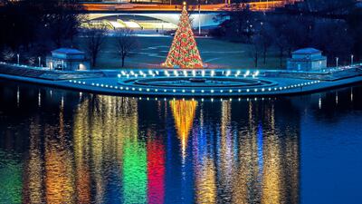 The Christmas tree at Point State Park in downtown Pittsburgh is illuminated at dawn on Christmas Eve. AP