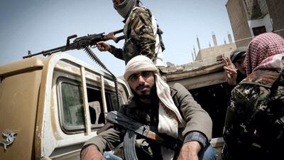 Syrian Democratic Forces (SDF) fighters on patrol in central Raqqa, the Syrian stronghold of ISIS they recaptured in October 2017. David Pratt for The National