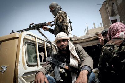Syrian Democratic Forces (SDF) fighters on patrol in central Raqqa, the Syrian stronghold of ISIS they recaptured in October 2017. David Pratt for The National
