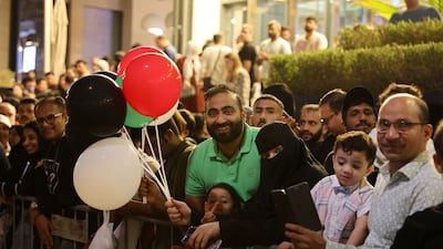 People wait to watch the fireworks at Dubai Festival City Mall. Pawan Singh / The National