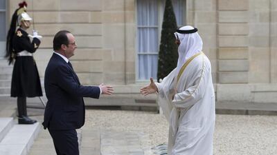 President Hollande greets Sheikh Mohammed bin Zayed as he arrives for a meeting at the Elysee Palace. Ian Langsdon / EPA