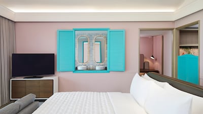 The fitting colour scheme includes pops of turquoise, mirroring the lagoon outside.