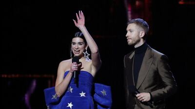 Dua Lipa and Calvin Harris with the award for British Single. REUTERS/Hannah McKay
