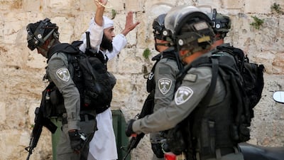 A Palestinian gestures as he confronts Israeli police during clashes at the compound that houses Al Aqsa Mosque on May 10. Reuters