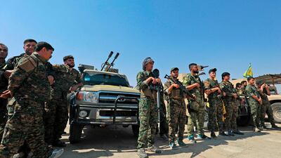 Members of the People's Protection Units (YPG) gather in the town of Shadadi. AFP