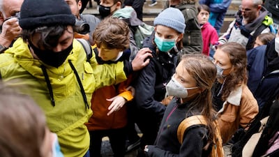 Greta Thunberg leaves after lending her support to campaigners in London. AFP