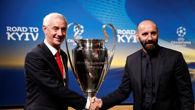 Liverpool club ambassador Ian Rush, left, and Roma sporting director Monchi pose with the Champions League trophy after the draw was made for the semi-finals earlier this month. Stefan Wermuth / Reuters