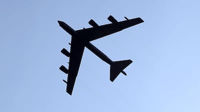 A US Air Force B-52 flies over a retirement ceremony for US Army Chief of Staff Gen. Ray Odierno at Joint Base Myer-Henderson, August 14, 2015 in Arlington, Virginia. AFP