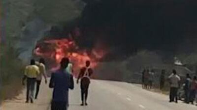 Plumes of black smoke fill the air.