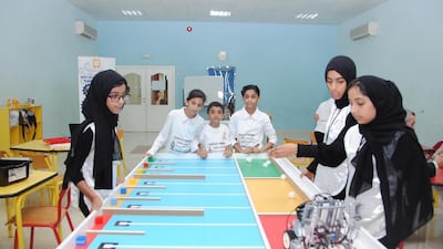 Children participate in the robotics competition at the Supreme Council for Family Affairs in Sharjah.