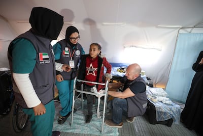 Healthcare workers with a young patient at the new centre. Photo: Wam