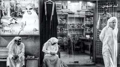 Amal, Kuwait: In the old Mubarakiah souq in Kuwait, Amal captures a traditional clothes shopkeeper and his friends as he opens up shop.