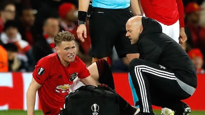 Manchester United's Scott McTominay receives treatment. PA