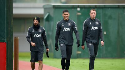 Manchester United's Juan Mata, Marcos Rojo and Phil Jones during the training session at the AON Training Complex. PA