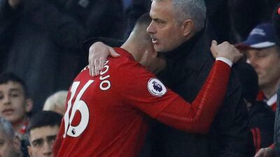 Manchester United's Marcos Rojo is embraced by manager Jose Mourinho after being substituted. Reuters