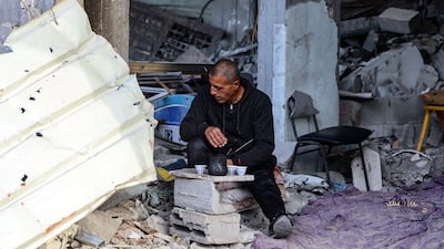 A Palestinian man sits amid the destruction in the Shujaiya neighbourhood of Gaza City this month. AFP