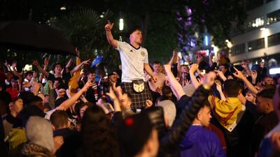 Scotland fans celebrate in London after the 0-0 draw with England. Reuters