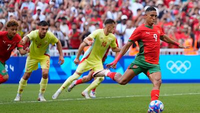Morocco's Soufiane Rahimi scores a penalty for their opening goal. AP